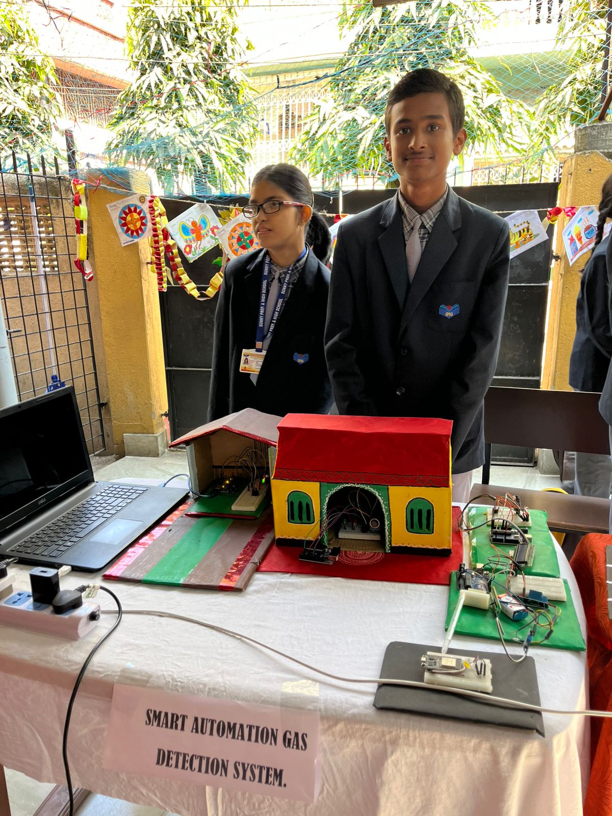 Young learners engaging in practical robotics activity